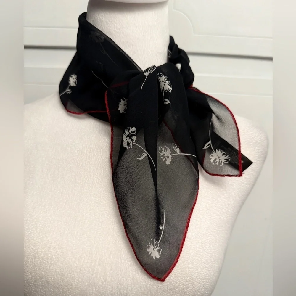 ECHO Small Black Sheer and stretch Scarf with white floral and red outline.
